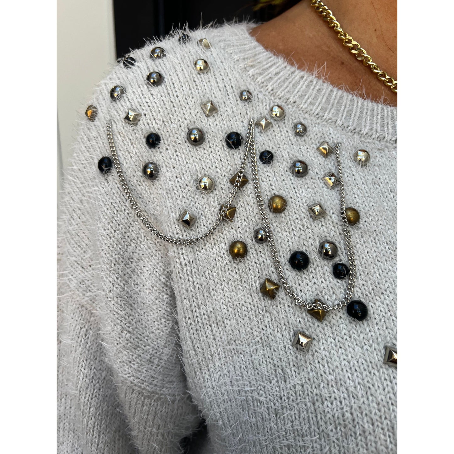 Can't help but love studded sweater